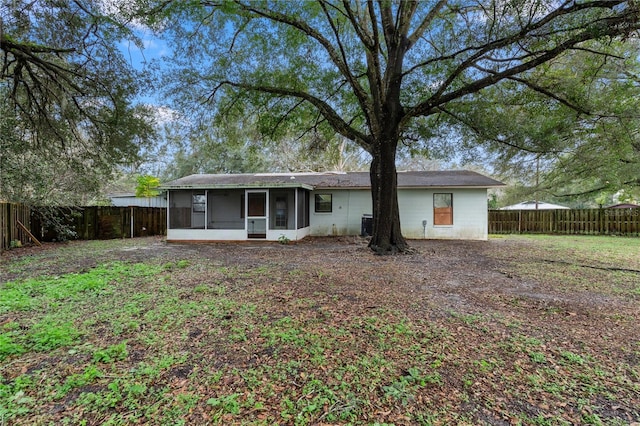 rear view of house with a sunroom