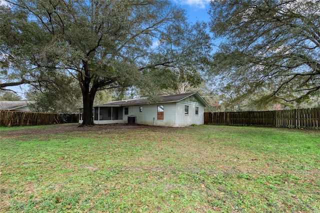 view of yard with a sunroom and cooling unit