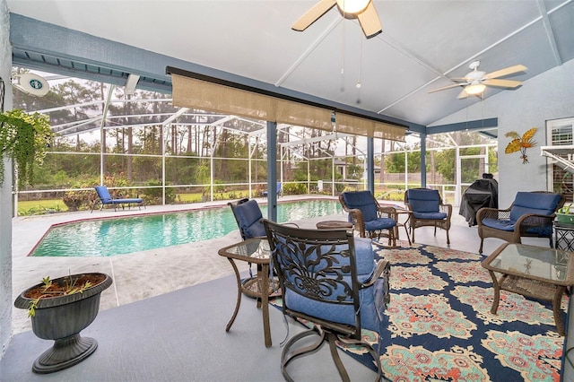 view of pool with a grill and ceiling fan