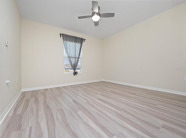 unfurnished room featuring ceiling fan and light hardwood / wood-style flooring