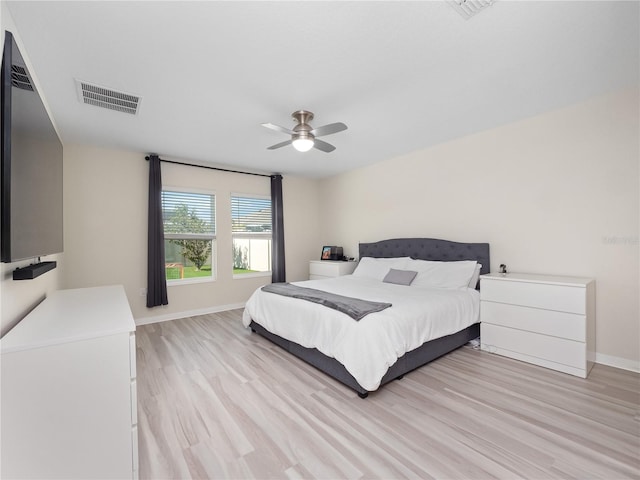 bedroom with light wood-type flooring and ceiling fan