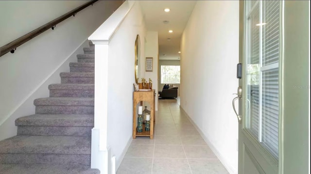 staircase featuring tile patterned floors