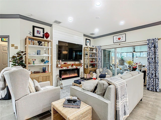 living room with ornamental molding