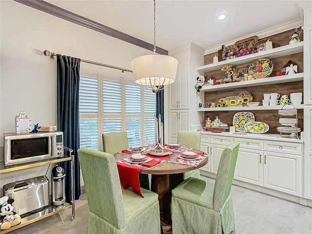 dining room featuring ornamental molding