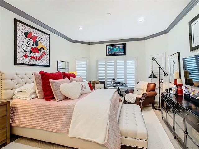 bedroom featuring ornamental molding and multiple windows