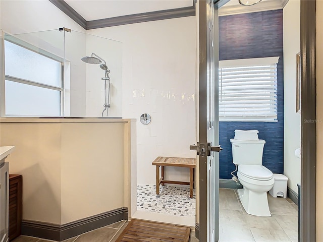 bathroom featuring vanity, crown molding, toilet, and walk in shower