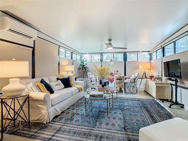 sunroom featuring ceiling fan, a wall unit AC, and a wealth of natural light