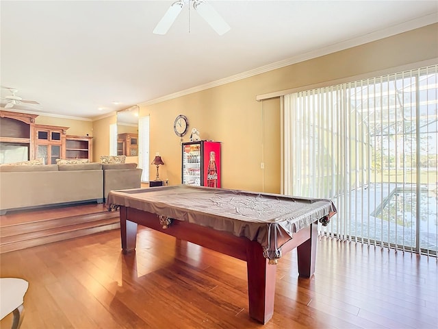 rec room with ceiling fan, hardwood / wood-style floors, billiards, and ornamental molding