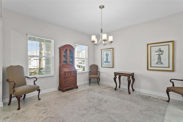 sitting room featuring a notable chandelier and light tile patterned flooring