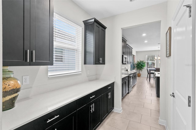 kitchen featuring pendant lighting and light tile patterned floors