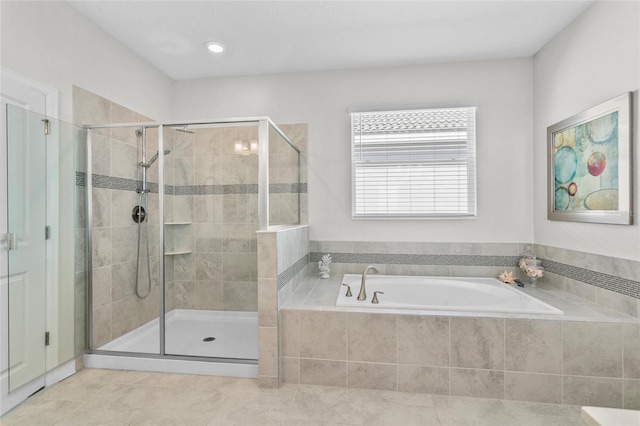 bathroom featuring tile patterned floors and independent shower and bath