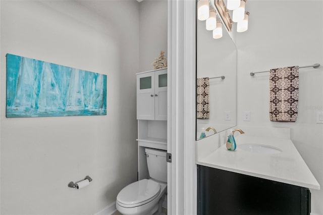 bathroom with toilet and vanity