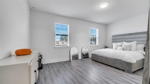 bedroom with light hardwood / wood-style floors