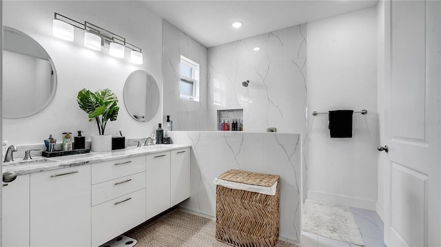 bathroom featuring vanity and a shower