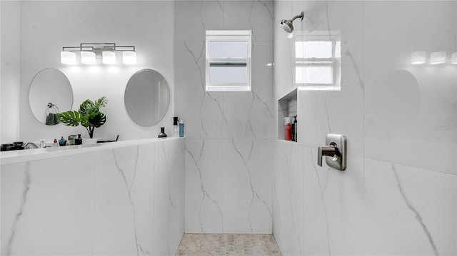 bathroom featuring a tile shower