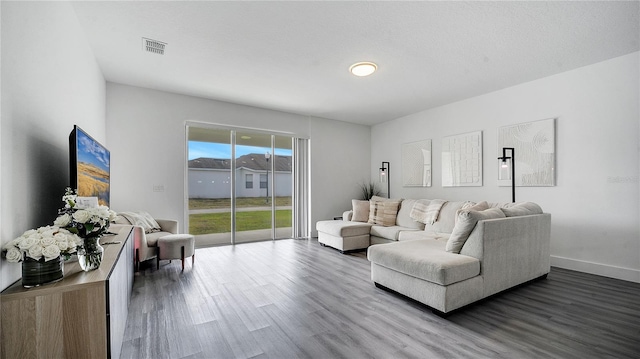 living room featuring dark hardwood / wood-style flooring