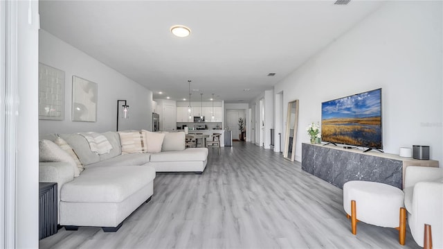 living room featuring light hardwood / wood-style floors