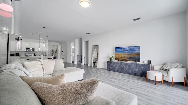 living room featuring light wood-type flooring