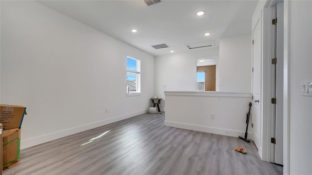 spare room with light hardwood / wood-style flooring