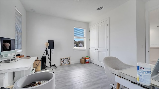 home office featuring light hardwood / wood-style floors