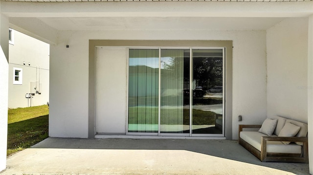 property entrance with a patio area