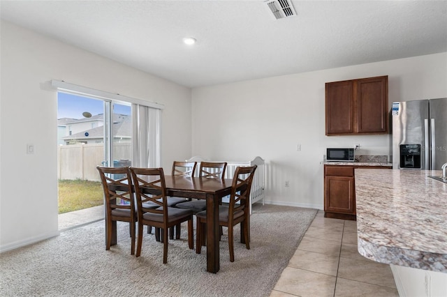 dining room with light tile patterned floors