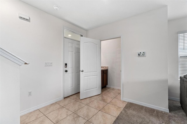 interior space featuring light tile patterned floors