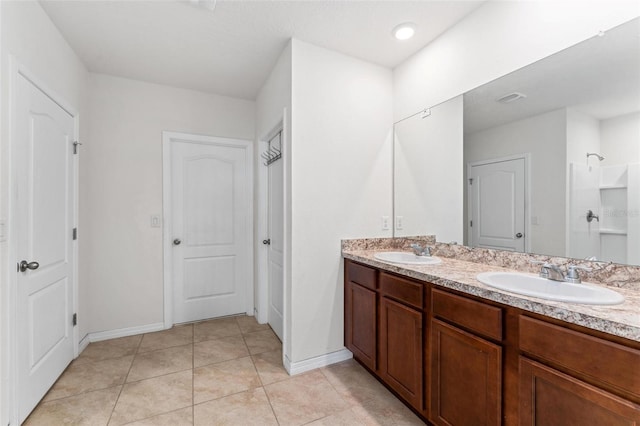 bathroom with vanity and tile patterned floors