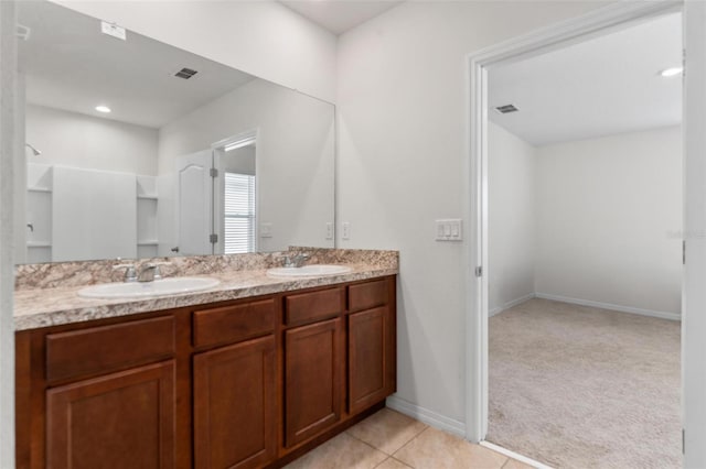 bathroom with vanity and tile patterned flooring