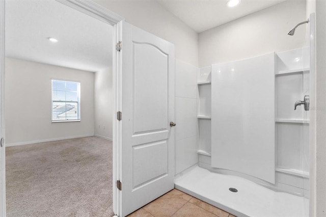 bathroom featuring tile patterned flooring and a shower