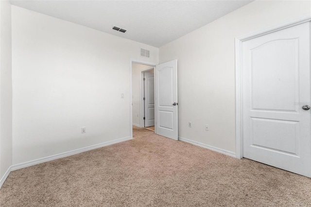 unfurnished bedroom with light carpet