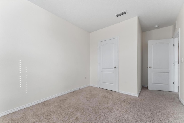 unfurnished bedroom with light carpet