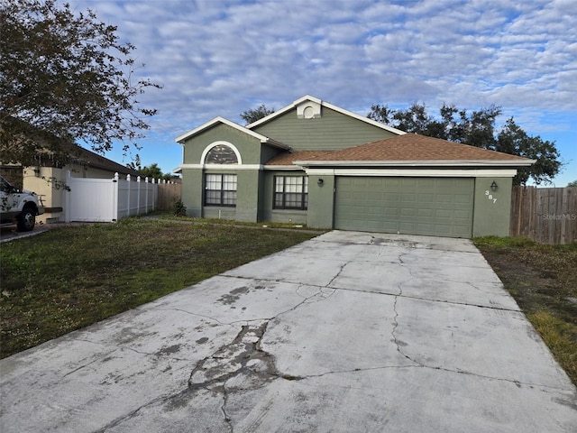 ranch-style home with a garage and a front yard