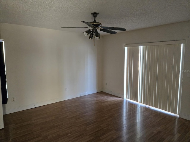 spare room featuring a textured ceiling, ceiling fan, and dark hardwood / wood-style flooring