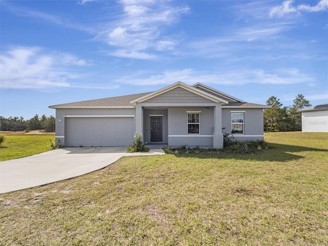 view of front facade featuring a front yard and a garage