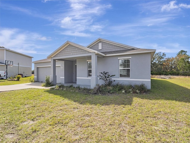 view of front of house with a garage and a front lawn