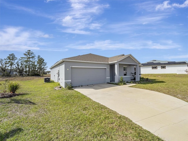 single story home featuring a front yard and a garage