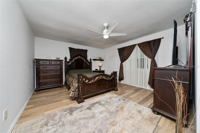 bedroom with light wood-type flooring and ceiling fan