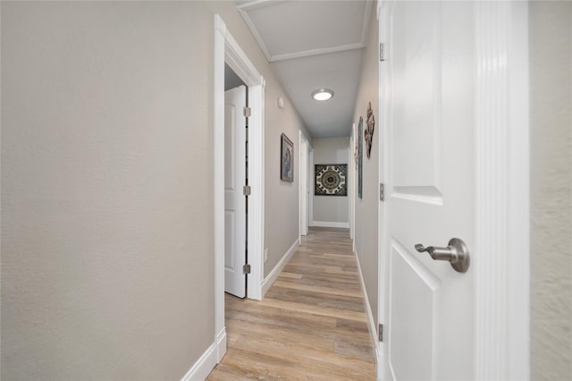 corridor with light hardwood / wood-style flooring