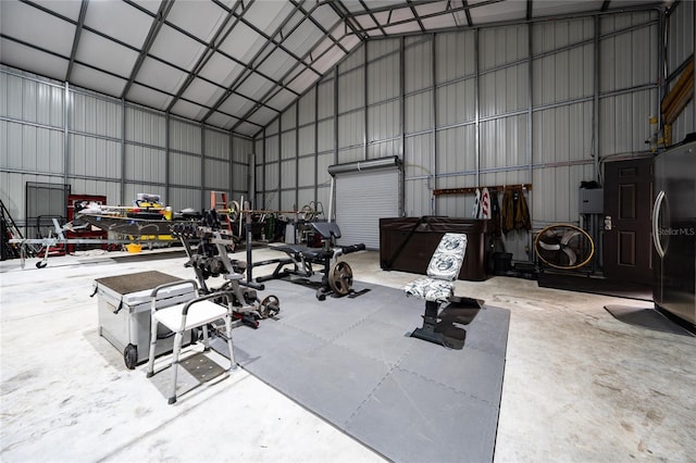 garage with stainless steel refrigerator