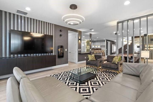 living room with light hardwood / wood-style flooring