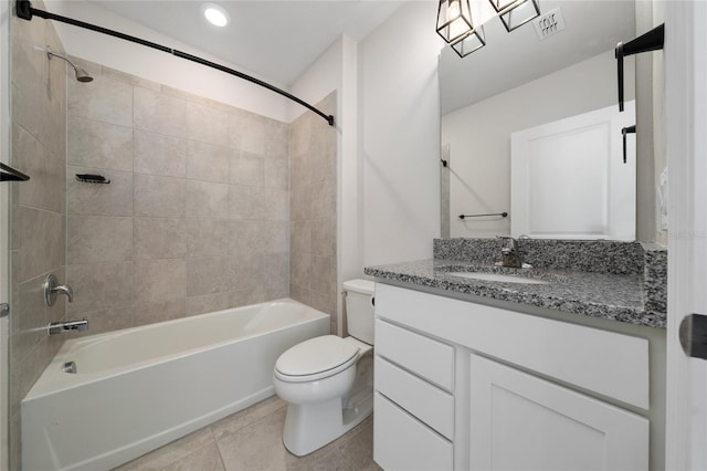 full bathroom featuring toilet, tiled shower / bath combo, tile patterned floors, and vanity