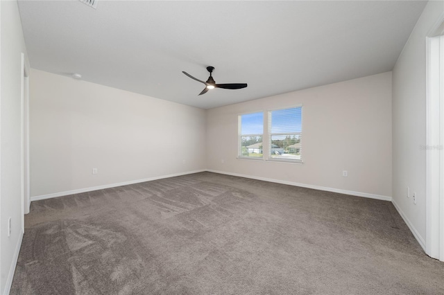 carpeted empty room featuring ceiling fan