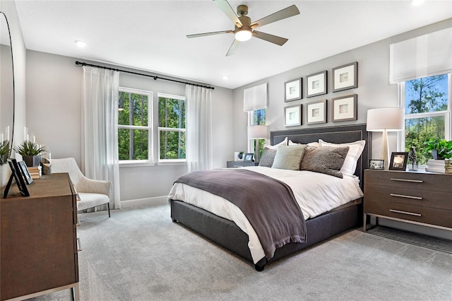 carpeted bedroom featuring ceiling fan