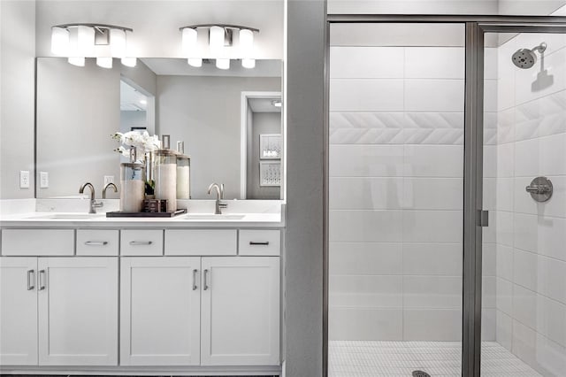 bathroom with walk in shower and vanity