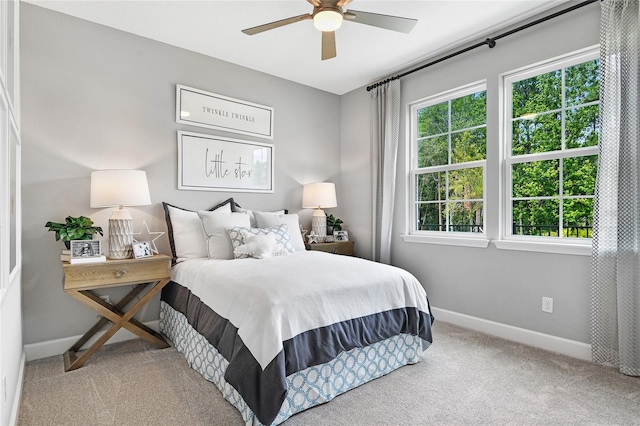 carpeted bedroom featuring ceiling fan