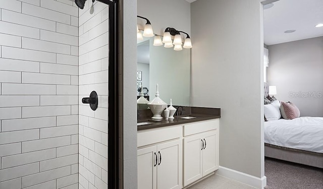 bathroom with vanity and tiled shower