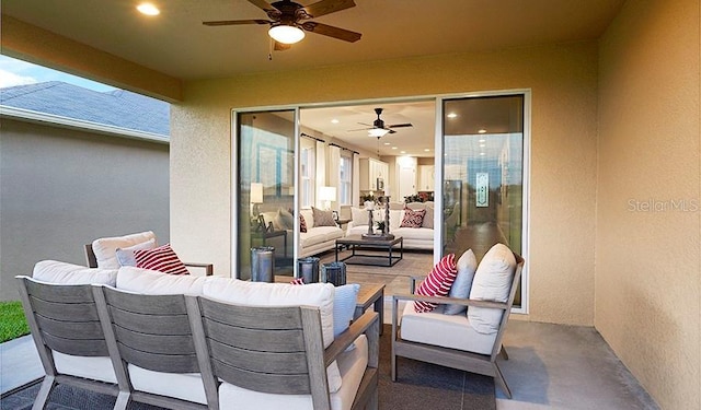 view of patio with an outdoor living space and ceiling fan