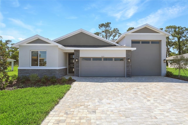 9093 Players Dr, Weeki Wachee, FL 34613 - view of front of home with driveway, a garage, stucco siding, and stone siding