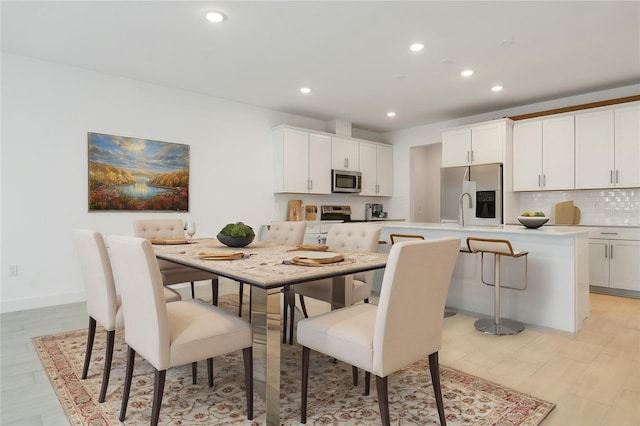 9093 Players Dr, Weeki Wachee, FL 34613 - dining space featuring recessed lighting and light wood-type flooring